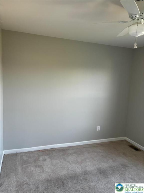 4954 Coatbridge Ln, Lehigh Twp, PA 18088 - carpeted spare room with baseboards and ceiling fan