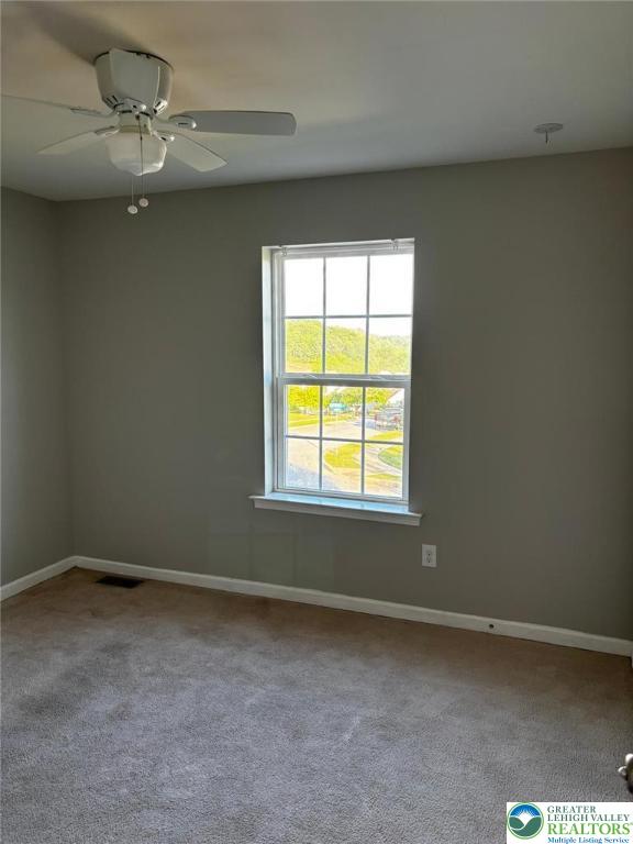 4954 Coatbridge Ln, Lehigh Twp, PA 18088 - carpeted empty room featuring baseboards and ceiling fan