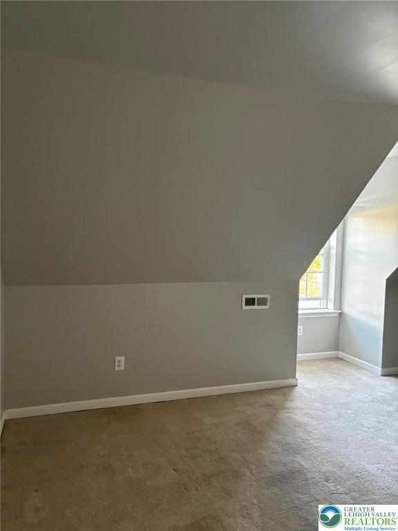 4954 Coatbridge Ln, Lehigh Twp, PA 18088 - additional living space featuring carpet and lofted ceiling