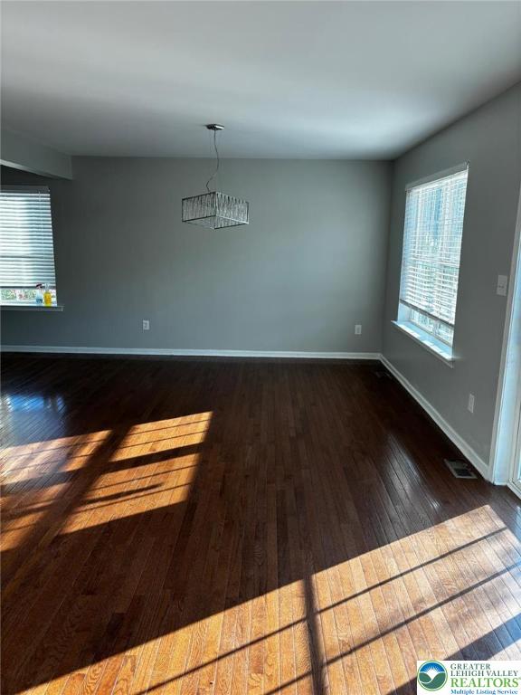 4954 Coatbridge Ln, Lehigh Twp, PA 18088 - unfurnished dining area featuring hardwood / wood-style floors and baseboards