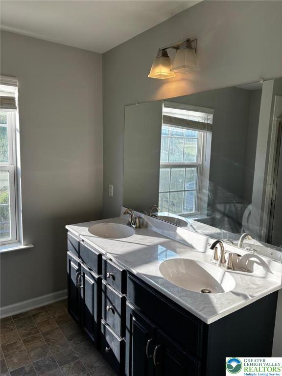 4954 Coatbridge Ln, Lehigh Twp, PA 18088 - full bathroom with healthy amount of natural light and double vanity