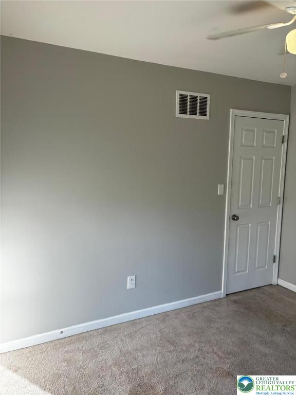 4954 Coatbridge Ln, Lehigh Twp, PA 18088 - carpeted spare room featuring baseboards and a ceiling fan