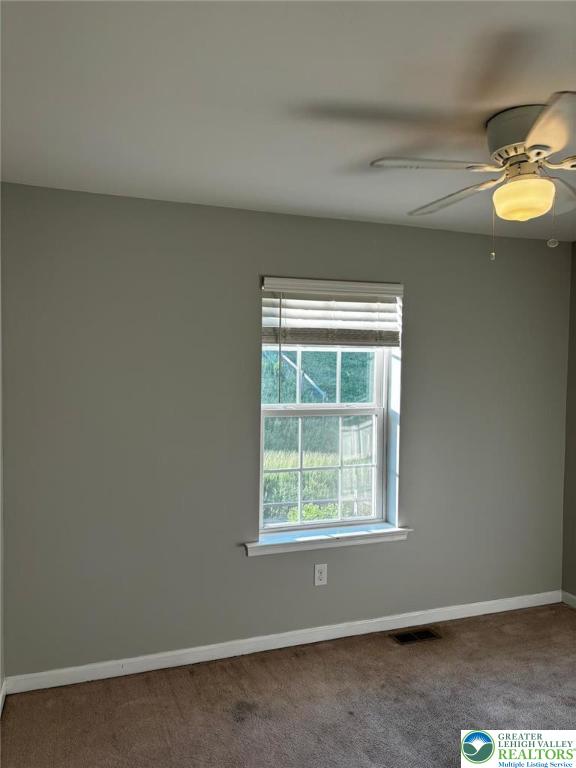 4954 Coatbridge Ln, Lehigh Twp, PA 18088 - carpeted empty room with baseboards and a ceiling fan
