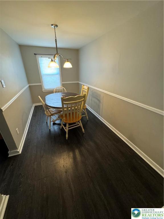 449 E Garrison St, Bethlehem City, PA 18018 - dining room with dark wood-style floors and baseboards