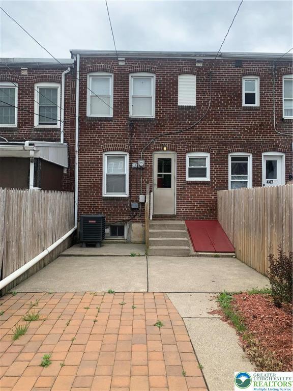 449 E Garrison St, Bethlehem City, PA 18018 - back of house featuring brick siding and a patio