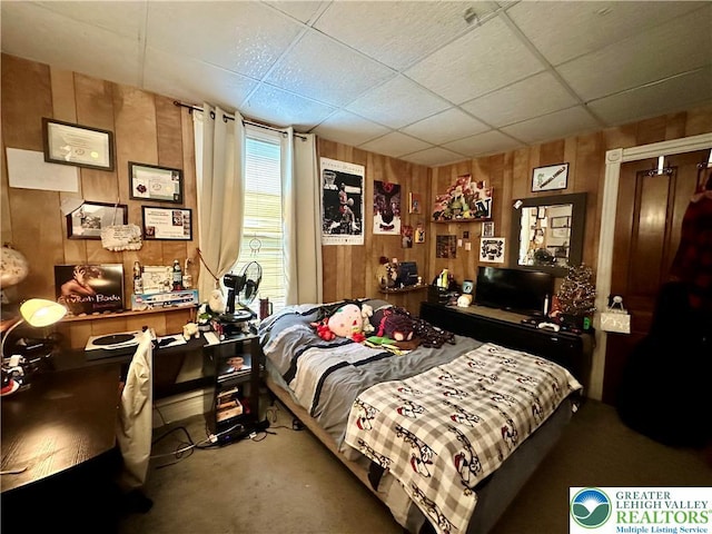 189 W 27th St, Northampton Boro, PA 18067 - bedroom with wooden walls, concrete floors, and a paneled ceiling