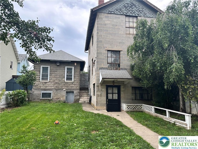189 W 27th St, Northampton Boro, PA 18067 - view of front facade with stone siding and a chimney