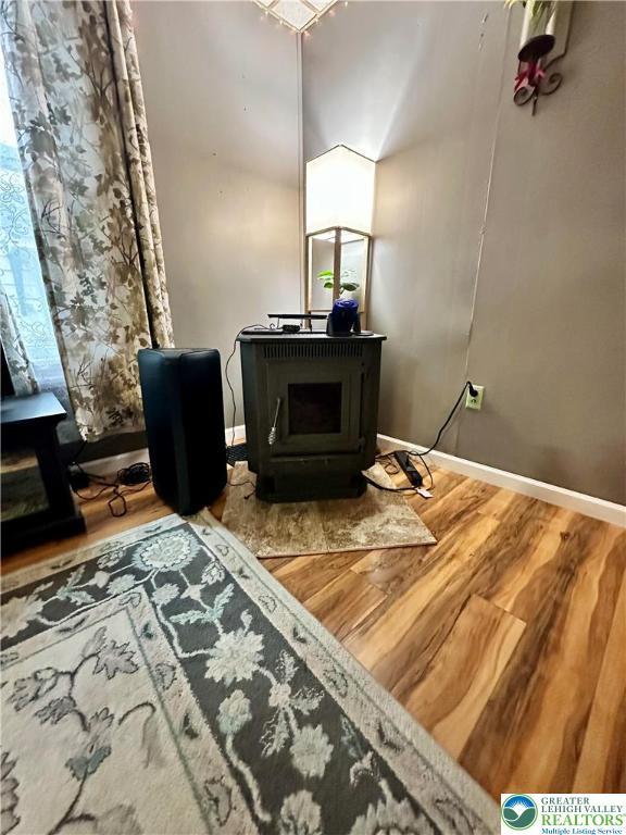 189 W 27th St, Northampton Boro, PA 18067 - sitting room featuring a wood stove and wood finished floors