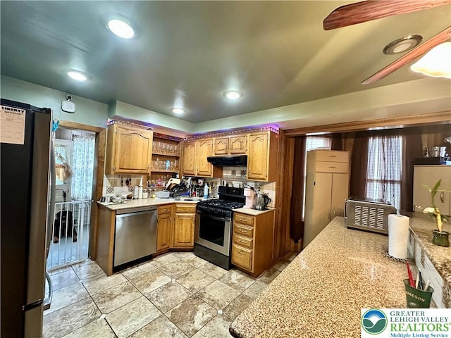 189 W 27th St, Northampton Boro, PA 18067 - kitchen featuring stainless steel appliances, light countertops, open shelves, under cabinet range hood, and brown cabinets