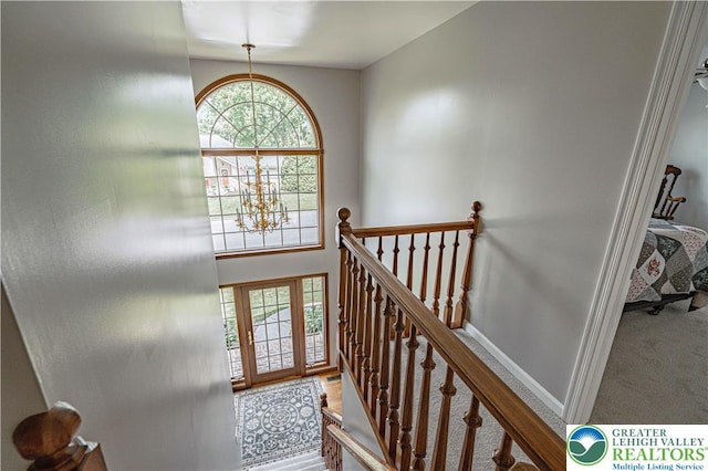 2029 Amherst Dr, Lower Saucon Twp, PA 18015 - stairs featuring a chandelier and carpet flooring