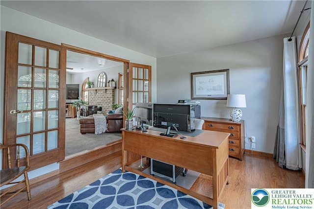 2029 Amherst Dr, Lower Saucon Twp, PA 18015 - office featuring wood finished floors and a brick fireplace