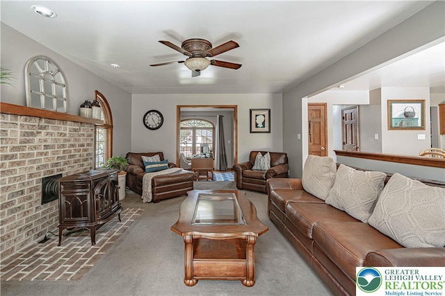 2029 Amherst Dr, Lower Saucon Twp, PA 18015 - carpeted living room with a ceiling fan and a wood stove