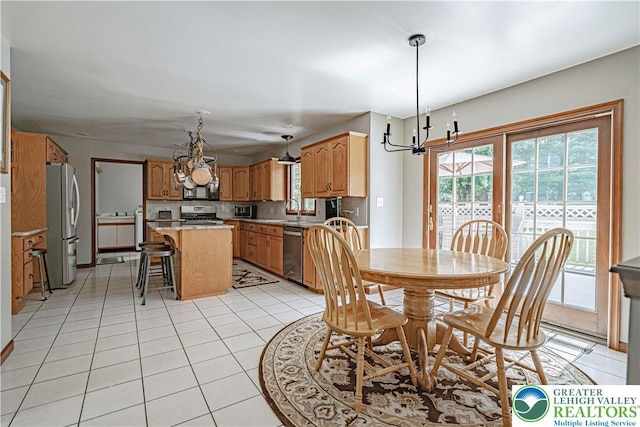2029 Amherst Dr, Lower Saucon Twp, PA 18015 - dining area with a chandelier and light tile patterned floors