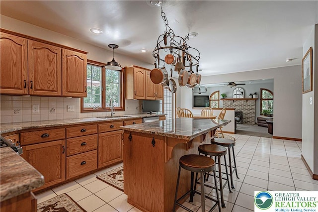2029 Amherst Dr, Lower Saucon Twp, PA 18015 - kitchen with light tile patterned floors, a kitchen island, open floor plan, and tasteful backsplash