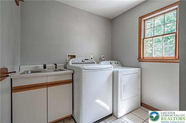 2029 Amherst Dr, Lower Saucon Twp, PA 18015 - washroom featuring washing machine and dryer, cabinet space, and light tile patterned floors