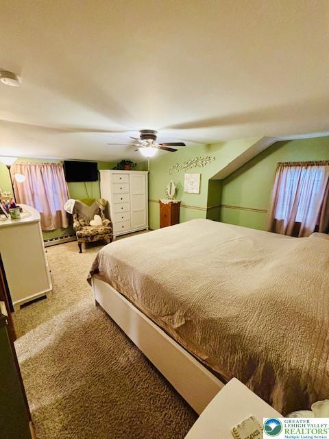 2734 Old Bethlehem Pike, Milford Twp, PA 18951 - carpeted bedroom with ceiling fan and a baseboard radiator