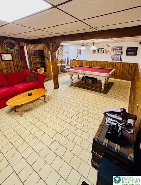 2734 Old Bethlehem Pike, Milford Twp, PA 18951 - rec room with wood walls, billiards, built in features, a drop ceiling, and tile patterned floors