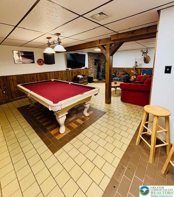 2734 Old Bethlehem Pike, Milford Twp, PA 18951 - rec room with a paneled ceiling, wainscoting, wooden walls, billiards, and a wood stove