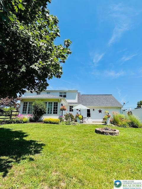 2734 Old Bethlehem Pike, Milford Twp, PA 18951 - back of property featuring an outdoor fire pit