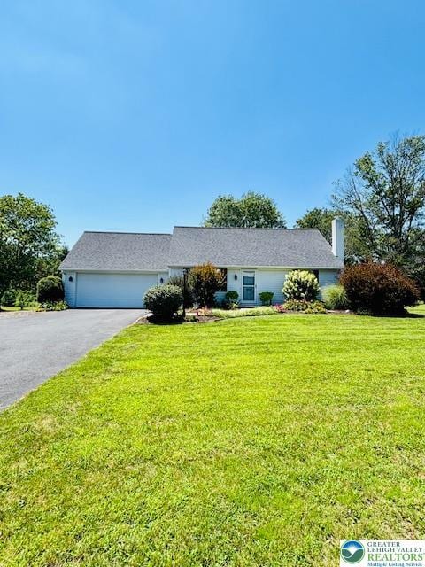 2734 Old Bethlehem Pike, Milford Twp, PA 18951 - ranch-style house with an attached garage, driveway, a front yard, and a chimney