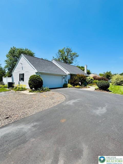 2734 Old Bethlehem Pike, Milford Twp, PA 18951 - view of front of house with asphalt driveway and an attached garage