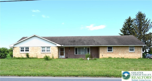 2841 Willow St, North Whitehall Twp, PA 18037 - ranch-style home with brick siding, covered porch, and a front lawn