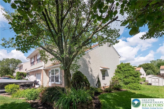 2721 Victoria Ln, Easton, PA 18045 - view of home's exterior with a lawn and a storage unit