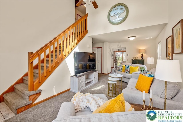 2721 Victoria Ln, Easton, PA 18045 - living area featuring a ceiling fan, stairs, carpet floors, and a high ceiling
