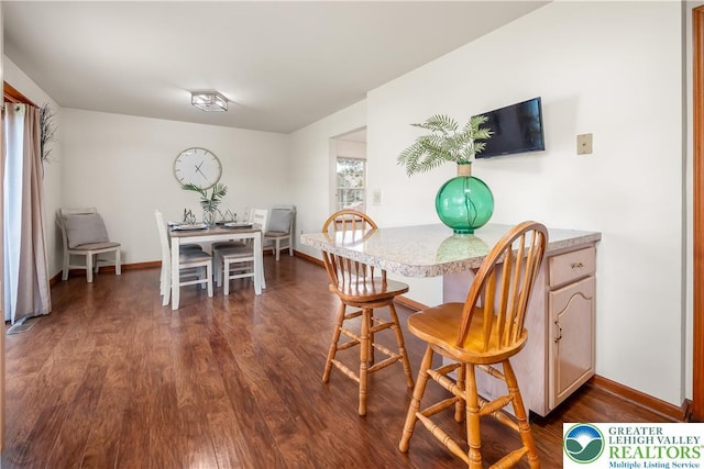 2721 Victoria Ln, Easton, PA 18045 - dining space featuring dark wood-type flooring and baseboards