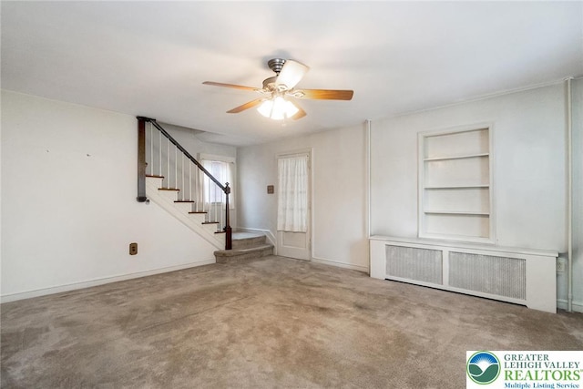457 E Lawn Rd, Upper Nazareth Twp, PA 18064 - carpeted foyer entrance with radiator, a ceiling fan, and stairs