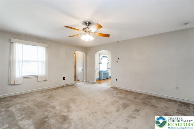 457 E Lawn Rd, Upper Nazareth Twp, PA 18064 - unfurnished room featuring arched walkways, ceiling fan, and light colored carpet