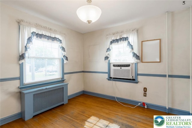 457 E Lawn Rd, Upper Nazareth Twp, PA 18064 - unfurnished room featuring radiator heating unit, wood finished floors, and cooling unit