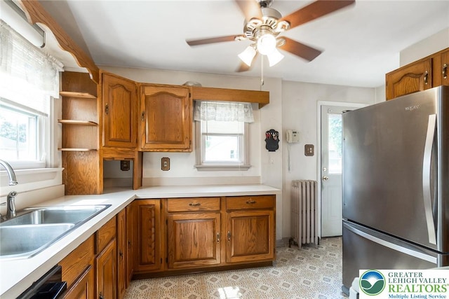 457 E Lawn Rd, Upper Nazareth Twp, PA 18064 - kitchen featuring freestanding refrigerator, radiator, healthy amount of natural light, and brown cabinetry