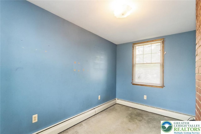 457 E Lawn Rd, Upper Nazareth Twp, PA 18064 - empty room featuring a baseboard heating unit and carpet
