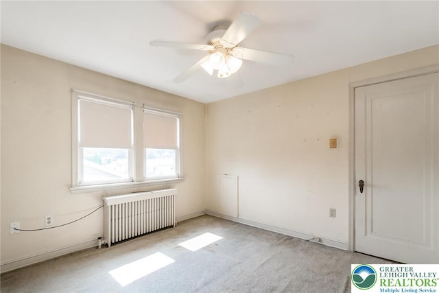 457 E Lawn Rd, Upper Nazareth Twp, PA 18064 - empty room with radiator, light carpet, and a ceiling fan