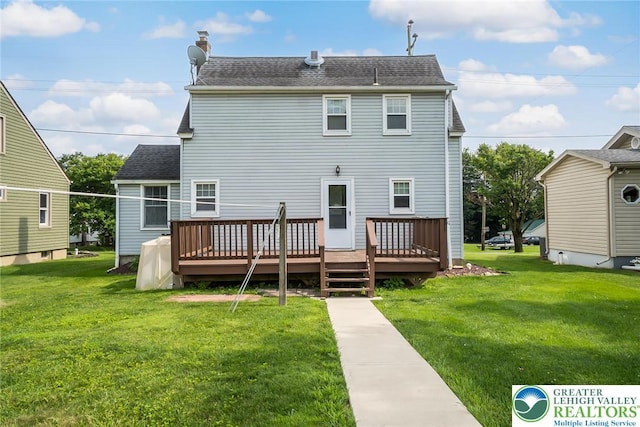 457 E Lawn Rd, Upper Nazareth Twp, PA 18064 - rear view of house featuring a yard, a deck, and a shingled roof