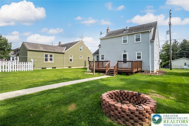 457 E Lawn Rd, Upper Nazareth Twp, PA 18064 - back of house with an outdoor fire pit, a deck, and a chimney