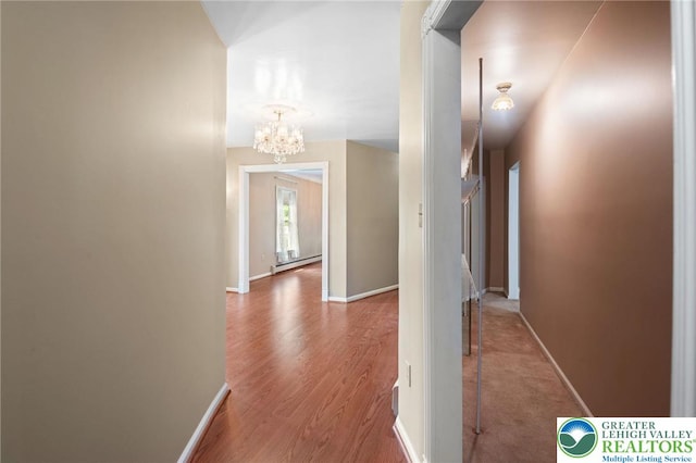 242 Schoeneck Ave, Nazareth Boro, PA 18064 - hallway featuring a chandelier and wood finished floors