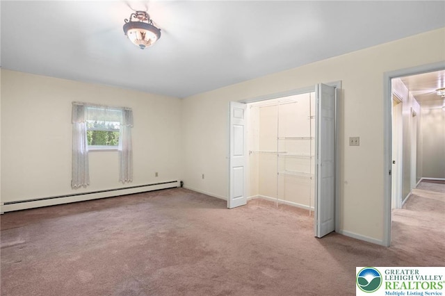 242 Schoeneck Ave, Nazareth Boro, PA 18064 - unfurnished bedroom featuring a baseboard heating unit and carpet flooring