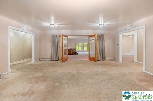 242 Schoeneck Ave, Nazareth Boro, PA 18064 - unfurnished living room with french doors, baseboard heating, and carpet floors