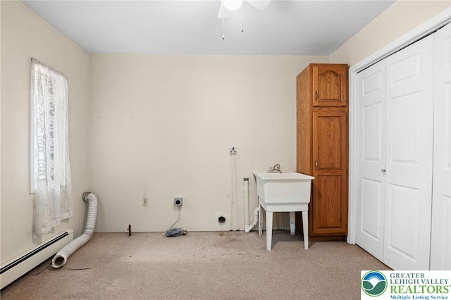 242 Schoeneck Ave, Nazareth Boro, PA 18064 - laundry area with a baseboard heating unit, light colored carpet, cabinet space, electric dryer hookup, and ceiling fan