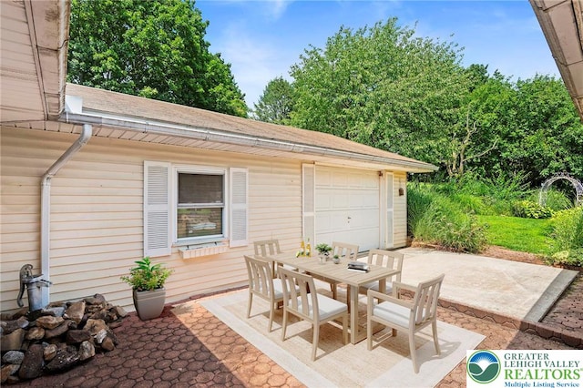 242 Schoeneck Ave, Nazareth Boro, PA 18064 - view of patio / terrace with outdoor dining area and a garage