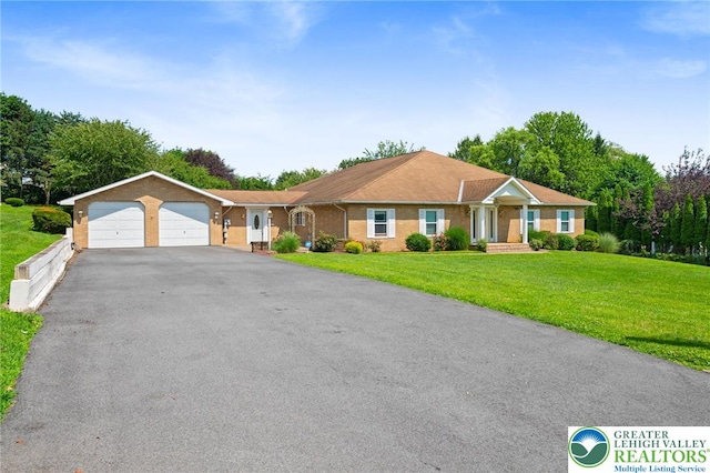 242 Schoeneck Ave, Nazareth Boro, PA 18064 - single story home with a garage, driveway, and a front lawn