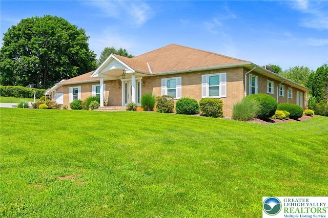 242 Schoeneck Ave, Nazareth Boro, PA 18064 - ranch-style home with brick siding and a front lawn