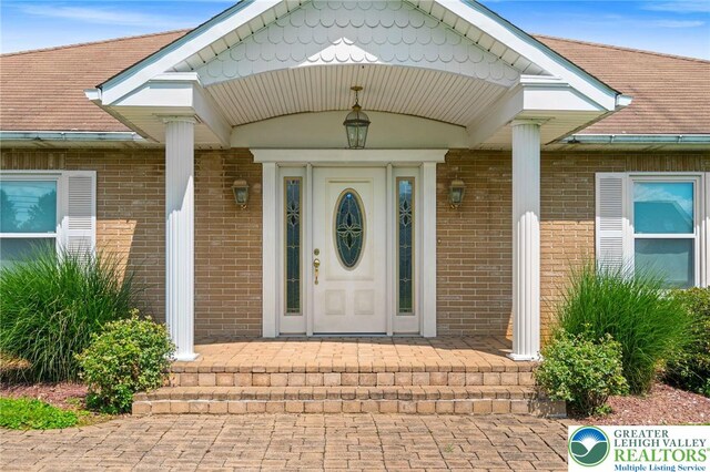 242 Schoeneck Ave, Nazareth Boro, PA 18064 - entrance to property featuring brick siding and a porch