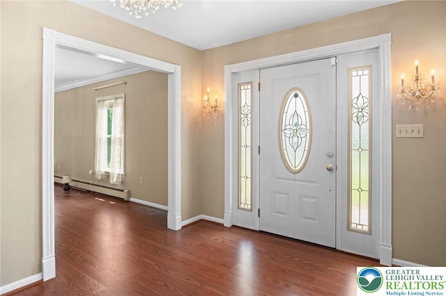 242 Schoeneck Ave, Nazareth Boro, PA 18064 - entryway with a chandelier, dark wood-type flooring, a baseboard heating unit, and crown molding