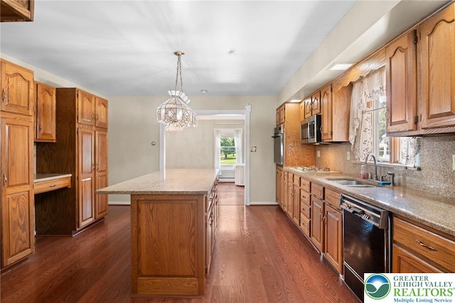 242 Schoeneck Ave, Nazareth Boro, PA 18064 - kitchen featuring appliances with stainless steel finishes, a center island, dark wood-style floors, and backsplash