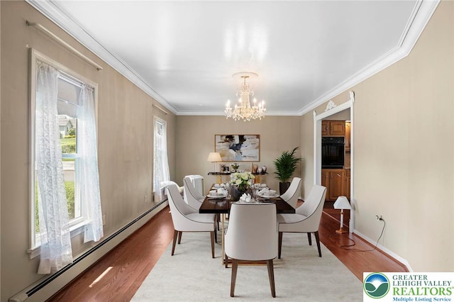 242 Schoeneck Ave, Nazareth Boro, PA 18064 - dining space with a baseboard radiator, light wood-style flooring, a chandelier, and crown molding