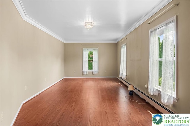 242 Schoeneck Ave, Nazareth Boro, PA 18064 - empty room featuring baseboard heating, wood finished floors, and crown molding