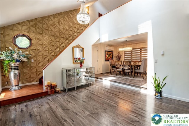 1555 Longleaf Dr, Chestnuthill Twp, PA 18330 - living area with a chandelier, wood finished floors, and high vaulted ceiling